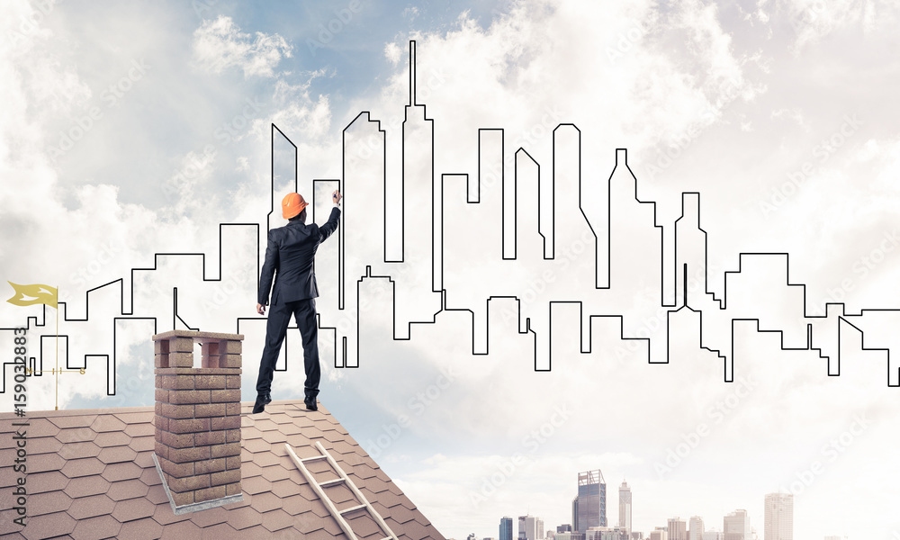 Man architect draw silhouette of modern city on blue sky. Mixed Man architect draw silhouette of modern city on blue sky. Mixed