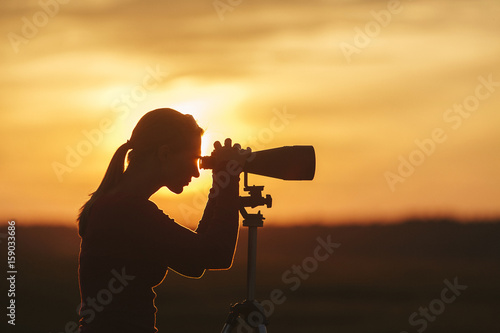 Woman With Binoculars on Marsh photo