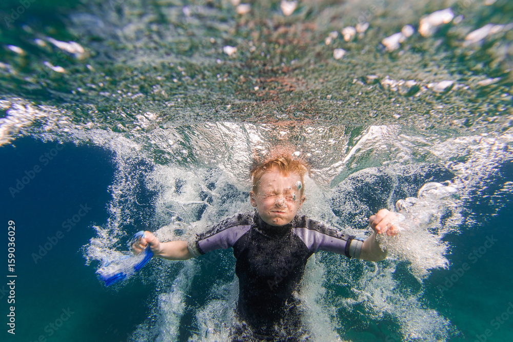 Bubbles and Underwater Splash of Boy Jumping Into Summer Lake From Water  Trampoline At Cottage Photos | Adobe Stock