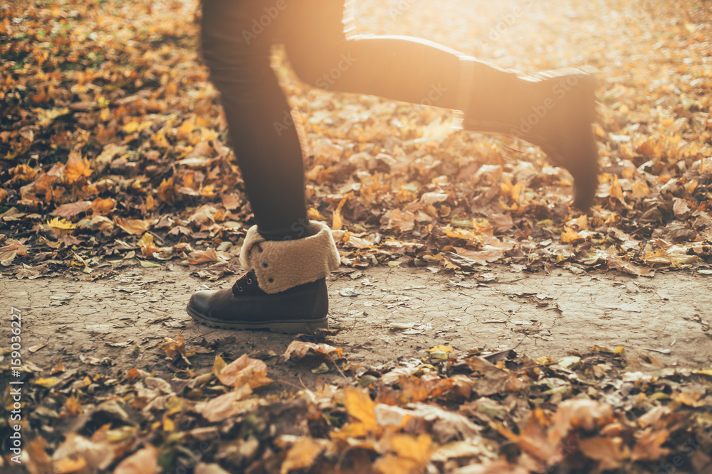 Young woman running in a winter shoes Young woman running in a winter shoes