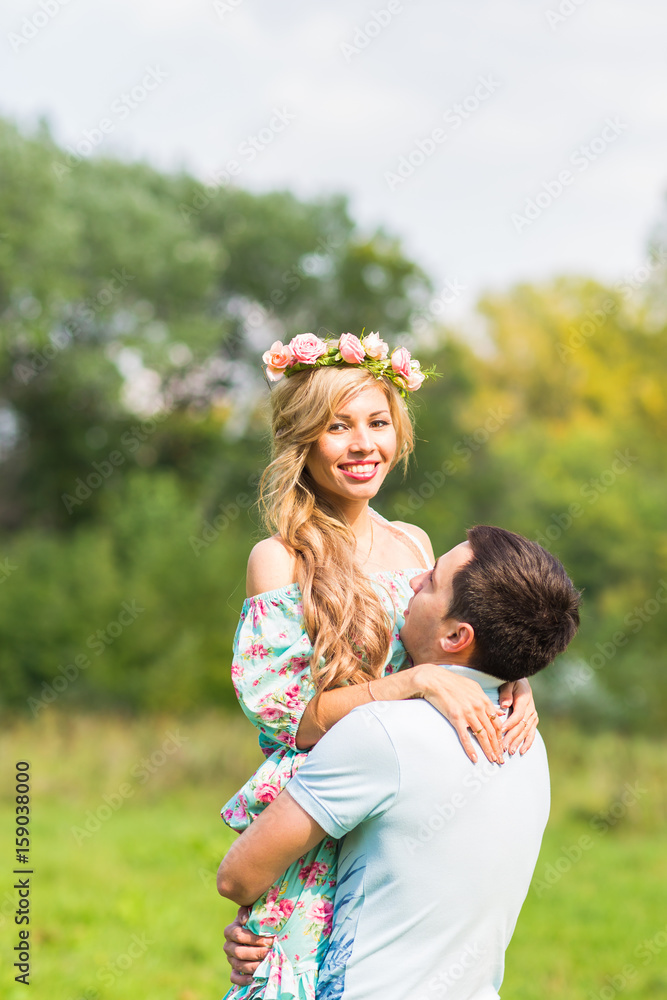 Fototapeta premium happy young couple hugging on nature