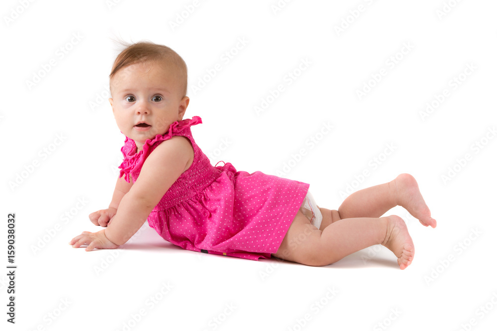 Baby girl in pink dress on white background
