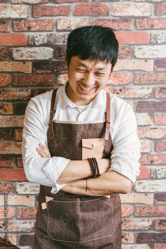 Portrait of young coffee owner photo