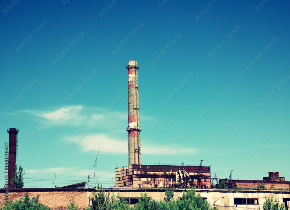 Brick pipe abandoned factory against the sky