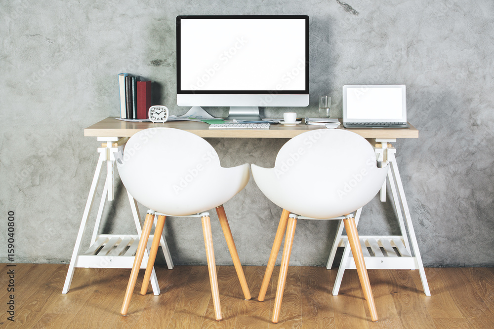 Fototapeta premium Contemporary office with empty pc and laptop