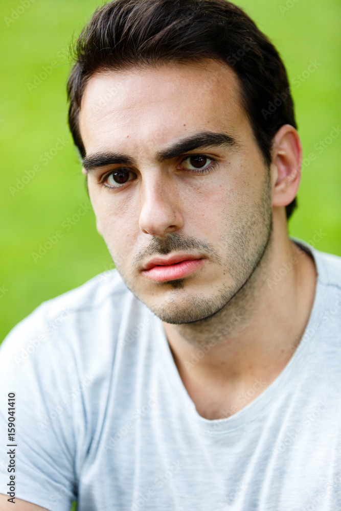 Potrait of attractive man in nature on daylight Potrait of attractive man in nature on daylight