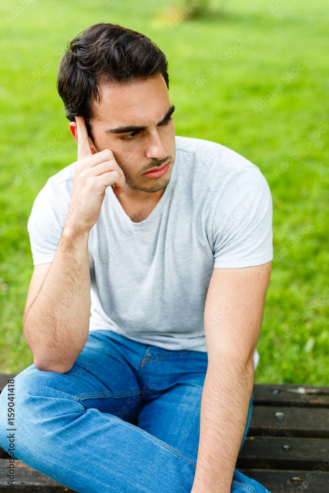 Potrait of attractive man in nature on daylight Potrait of attractive man in nature on daylight