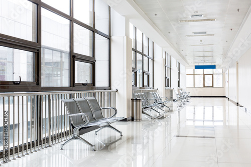 Empty chairs in waiting area at hospital