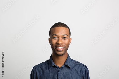 studio portrait of an excited young man 