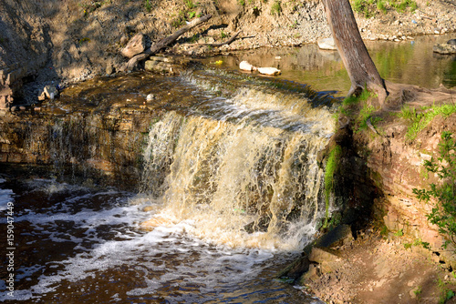 Small waterfall at sunny day. photo