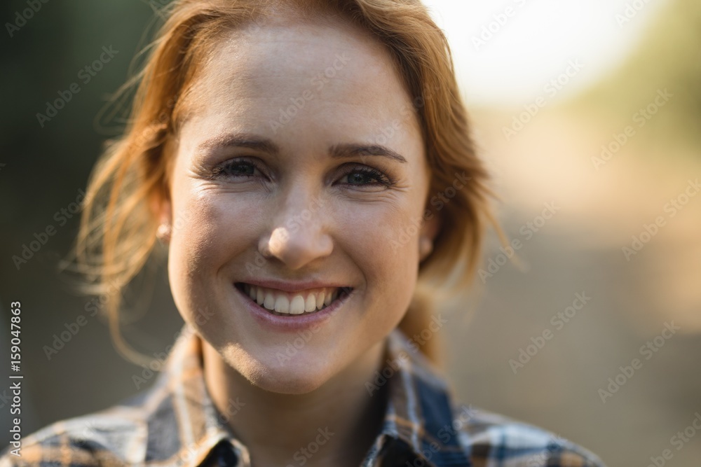 Fototapeta premium Portrait of smiling young woman at farm 
