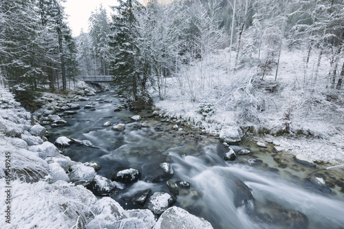 Winter river in frozen landscape photo