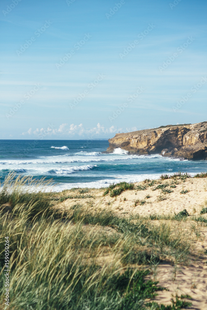 sandy beach landscape and rough rocks sandy beach landscape and rough rocks