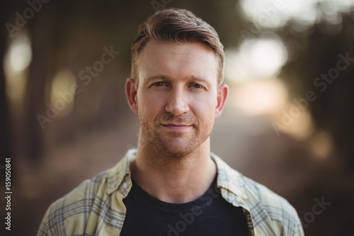 Portrait of handsome young man at olive farm photo