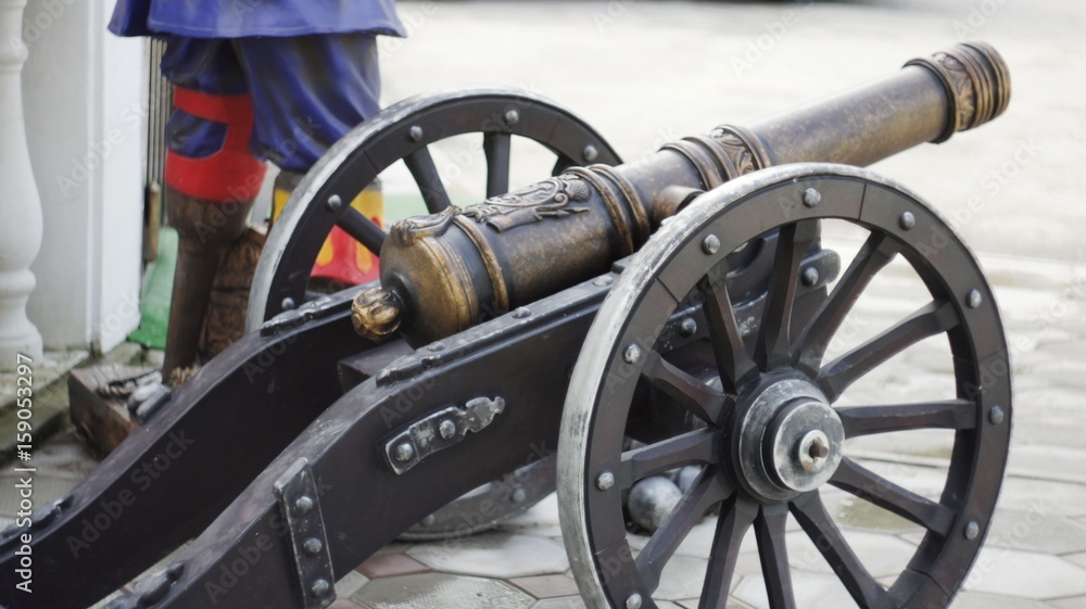 A copy of an old cannon with cores in the style of the times of colonization of the New World and the era of pirates, standing in the resort tourist zone of Nalchik.