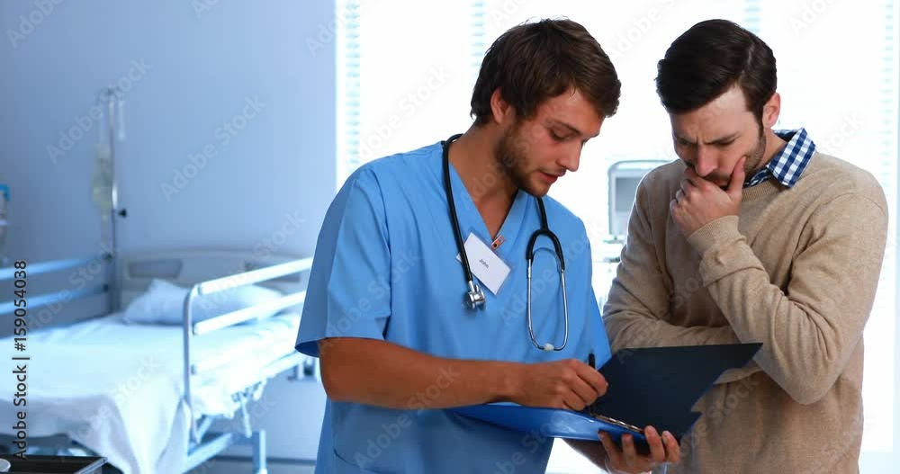 Doctor showing medical report to man Doctor showing medical report to man