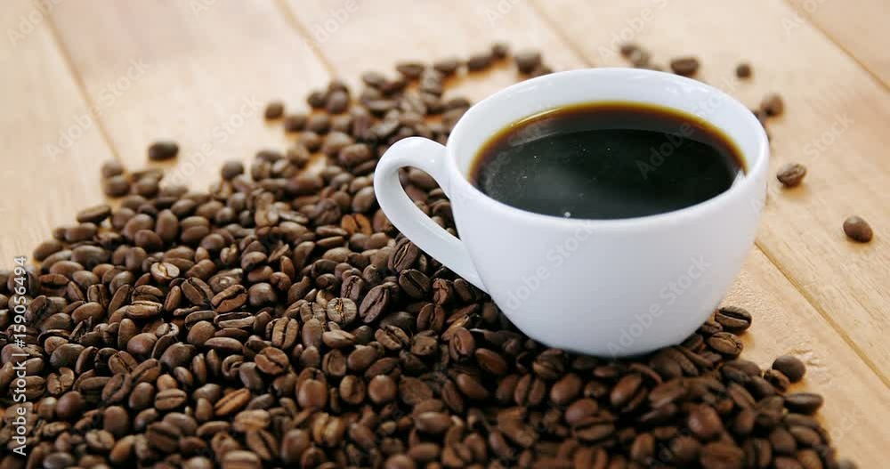 Black coffee with roasted beans Black coffee with roasted beans