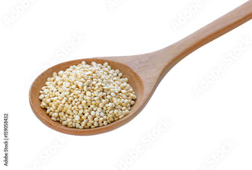 Quinoa in a wood spoon on white background