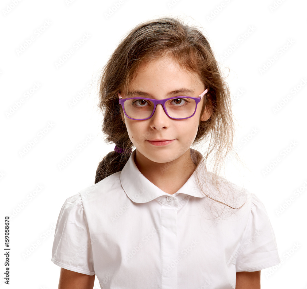 Serious schoolgirl in glasses