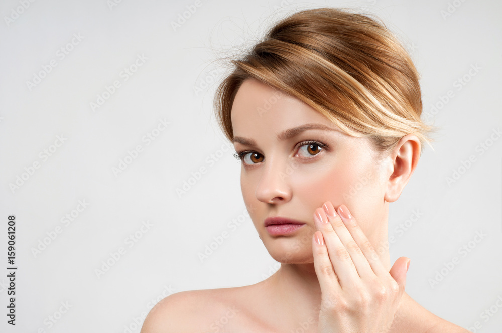 Beautiful woman with clean perfect skin touch own face. Beautiful woman with clean perfect skin touch own face.