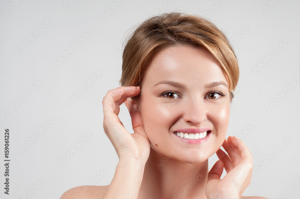 Beautiful woman with clean perfect skin touch own face. Beautiful woman with clean perfect skin touch own face.
