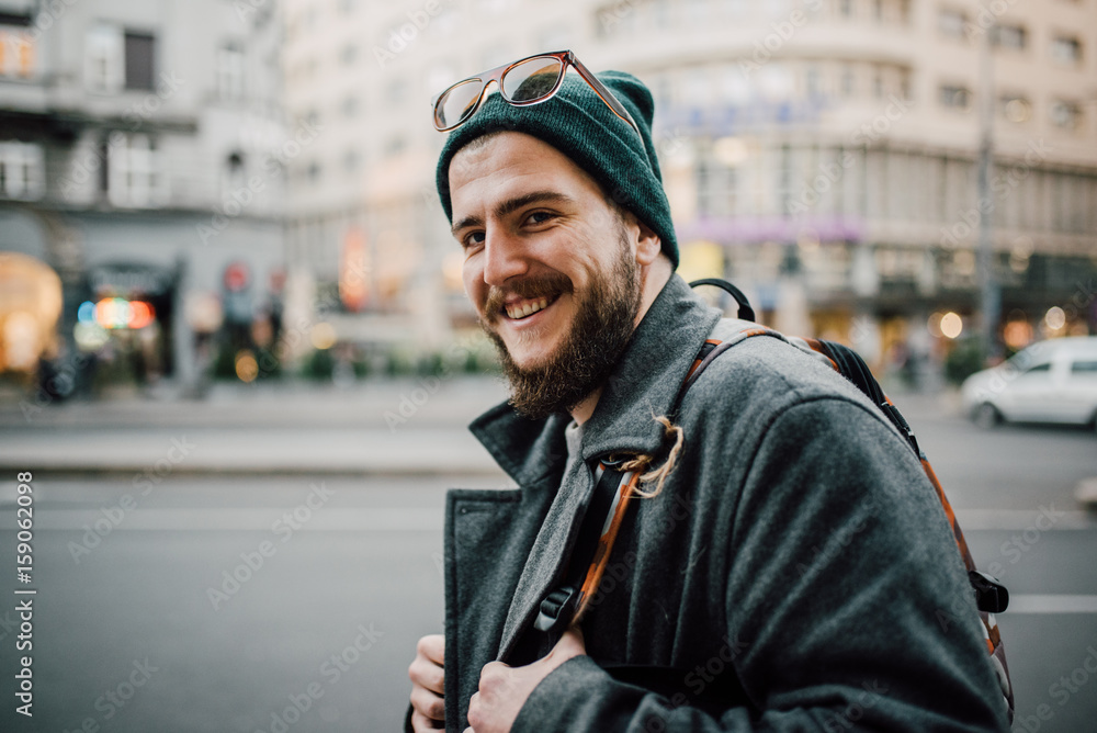 Close up of a young bearded man on the street Close up of a young bearded man on the street
