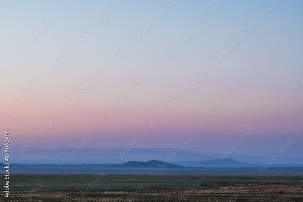 panoramic view of snow-capped mountain ranges at dusk
panoramic view of snow-capped mountain ranges at dusk