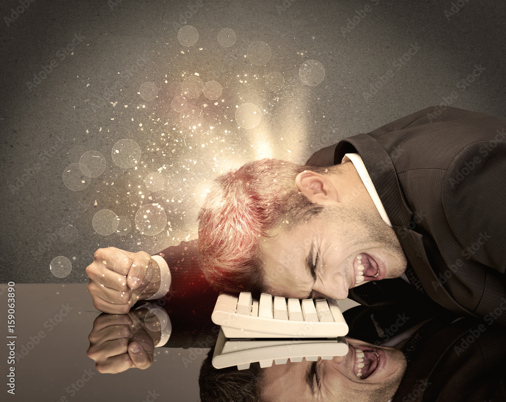 Obraz premium Angry businessman with lights and keyboard