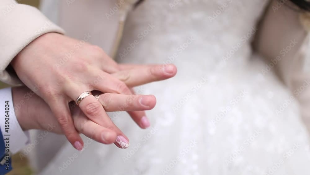 the bride and groom at the wedding, holding hands the bride and groom at the wedding, holding hands