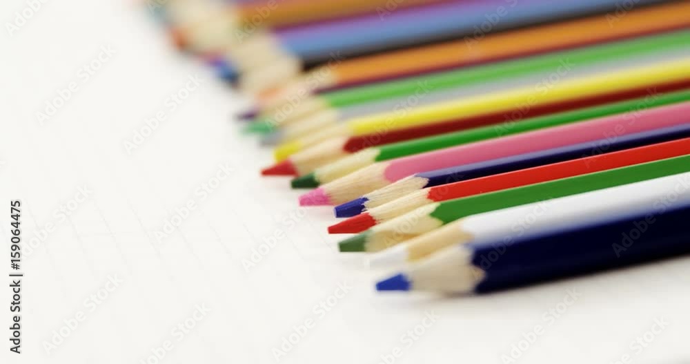 Colored pencils kept on the book Colored pencils kept on the book