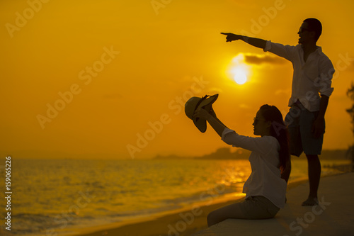 Lovely couple man and woman dating on the sun set beach, Concept of love and wedding