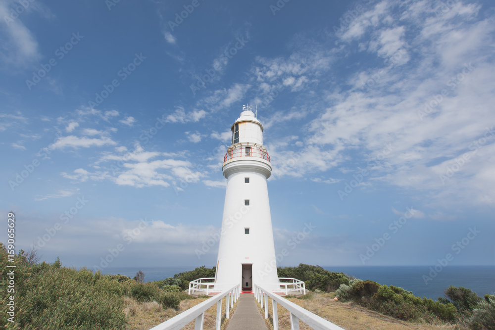 Symmetrical lighthouse on sunny day