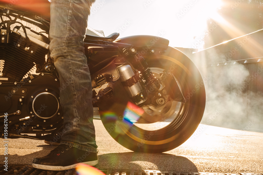 biker doing a burn out wiht his rear wheel from his bike Stock Photo ...