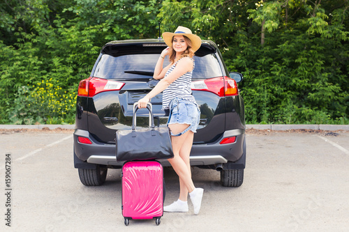 Summer vacation car road trip freedom concept. Happy woman cheering joyful during holiday travel with car. © satura_