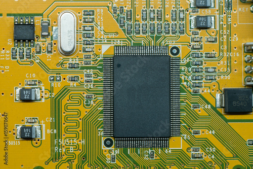 Close up of electronic multi layer circuit board, PCB, with microchip and components