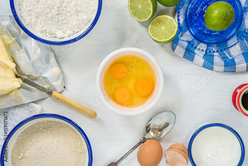Ingredients for lime cake on white background