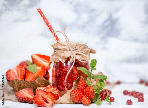 Summer drink with strawberries in a jar photo