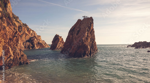 Amazing Wild rock beach at the sunset. Sintra Cascais Natural Park Portugal