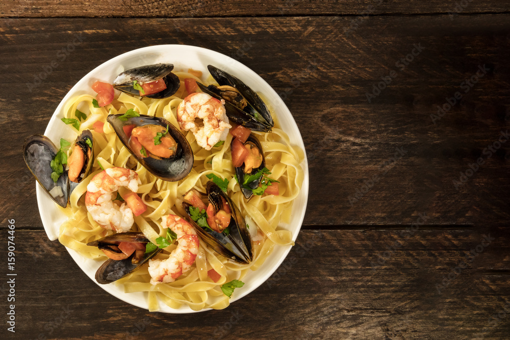 Seafood pasta dish with mussels and shrimps Seafood pasta dish with mussels and shrimps