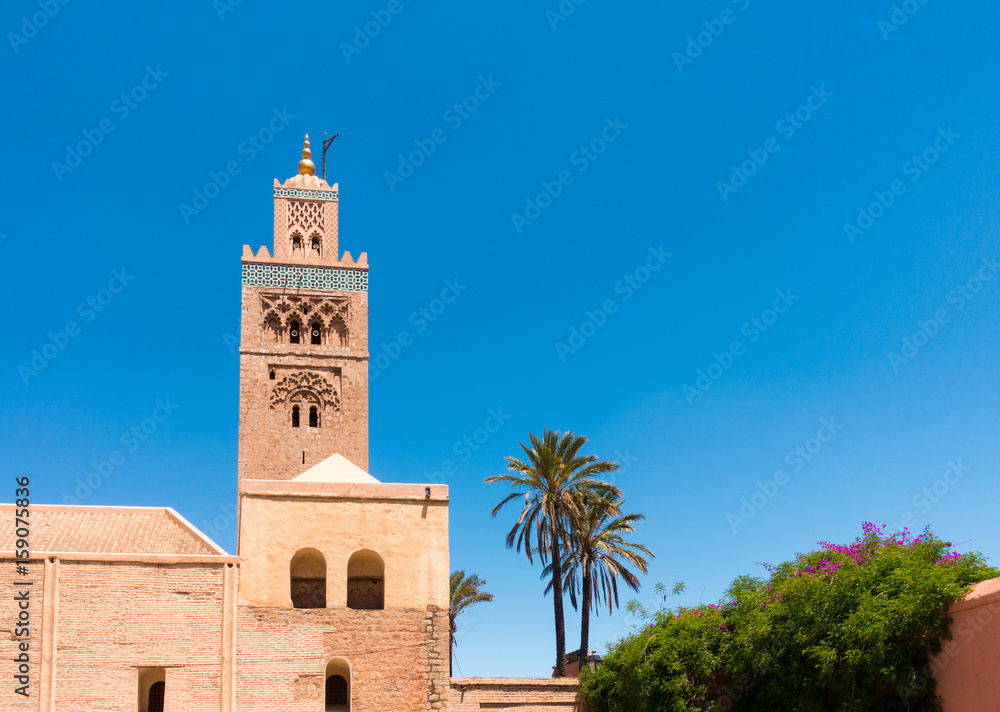 Closeup of the Koutoubia Mosque in Marrakech, Morocco, North Africa against clear blue sky.
