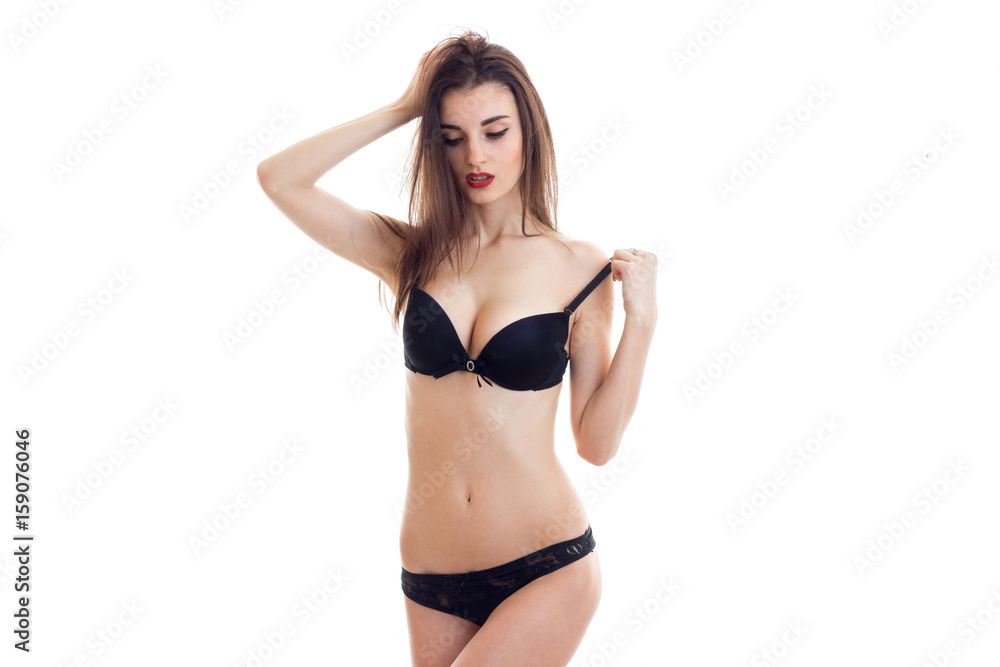 hot brunette woman in lingerie take off a bra Stock Photo