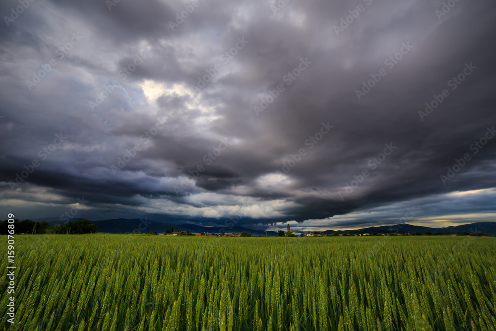 Evening storm over the medieval village Evening storm over the medieval village