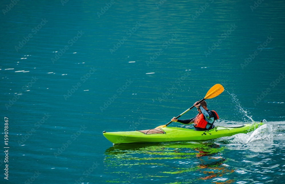 Caucasian Kayaker on the Lake
