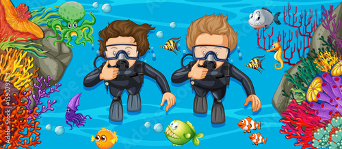 Scuba divers in the deep blue sea