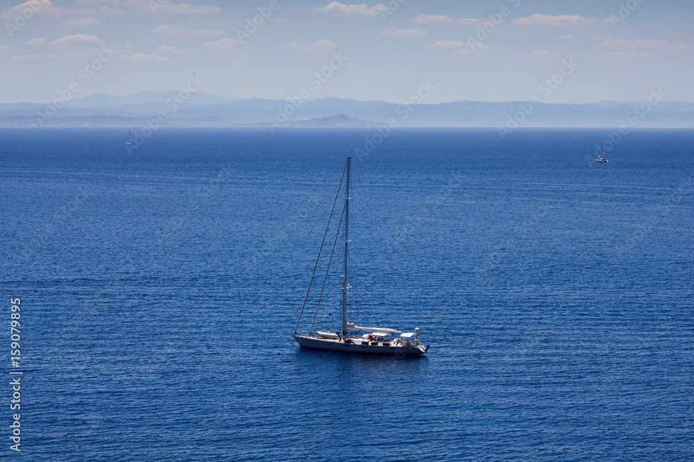 Sailing boats in the Mediterranean Sea. Yacht holidays at sea. Aerial view to sailboat. 