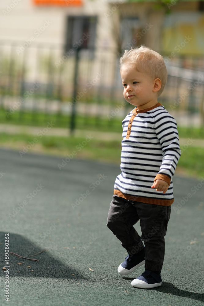 One year old baby boy toddler at playground One year old baby boy toddler at playground