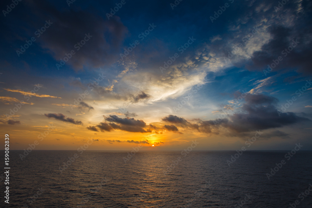 Blue sky and cloud at sea in twilight scene while sun set for background, seascape.