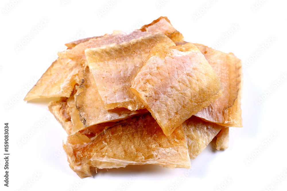 Pieces of Silver Cod Fish on a white background (isolated). Snack to beer. Close up Pieces of Silver Cod Fish on a white background (isolated). Snack to beer. Close up