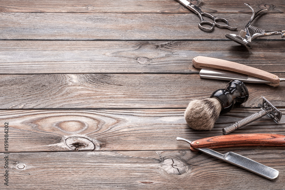 Vintage barber shop tools on wooden background