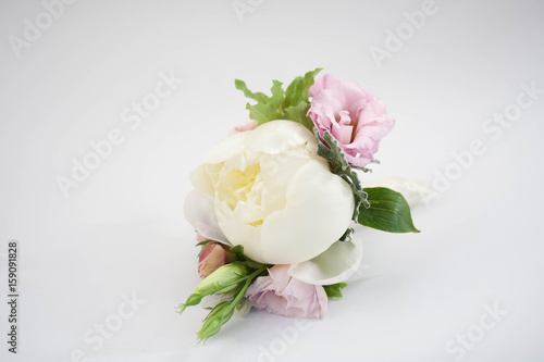 Boutonniere with pion, bouquet of groom